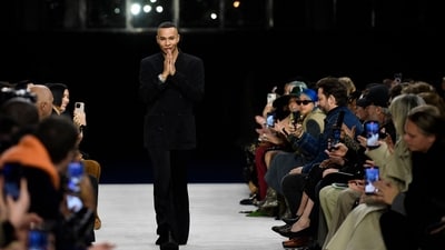 French fashion designer Olivier Rousteing greets spectators after presenting Balmain Womenswear Fall-Winter 2023-2024 collection during Paris Fashion Week in Paris, on March 1, 2023. More than 50 pieces from Balmain's forthcoming collection have been stolen, only ten days ahead of the company's show at Paris Fashion Week, Balmain designer Olivier Rousteing announced on his Instagram account. (Photo by JULIEN DE ROSA / AFP) French fashion designer Olivier Rousteing greets spectators after presenting Balmain Womenswear Fall-Winter 2023-2024 collection during Paris Fashion Week in Paris, on March 1, 2023. More than 50 pieces from Balmain's forthcoming collection have been stolen, only ten days ahead of the company's show at Paris Fashion Week, Balmain designer Olivier Rousteing announced on his Instagram account. (Photo by JULIEN DE ROSA / AFP)