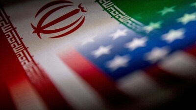 The Iranian and US flags are seen printed on paper in this illustration. (Reuters)