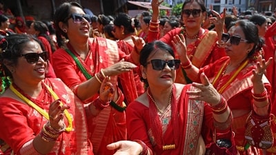 Women of various age groups, adorned in vibrant red traditional attire and ornaments, were observed singing folk songs and engaging in joyful dances to celebrate this special occasion. (AFP) Women of various age groups, adorned in vibrant red traditional attire and ornaments, were observed singing folk songs and engaging in joyful dances to celebrate this special occasion. (AFP)