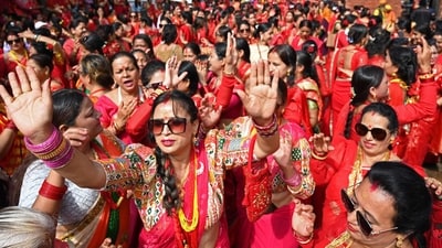 The festival begins with an early morning bath, and women honour Lord Shiva by lighting lamps and observing a fast as a form of homage. (AFP) The festival begins with an early morning bath, and women honour Lord Shiva by lighting lamps and observing a fast as a form of homage. (AFP)