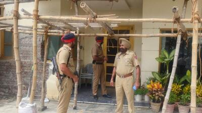 Police at the house of former minister Jagdish Singh Garcha, where he was found unconscious along with his wife, sister and a domestic help in Ludhiana on Monday. (Gurpreet Singh/HT)