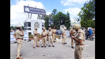 Police personnel stand guard at the main entrance of the Punjabi University during a protest staged by students in Patiala on Monday. (ANI) Police personnel stand guard at the main entrance of the Punjabi University during a protest staged by students in Patiala on Monday. (ANI)