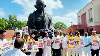 TDP MPs stage a protest in front of Gandhi statue against the arrest of party chief N Chandrababu Naidu, at the premises of new Parliament building, in New Delhi on Monday. (ANI) TDP MPs stage a protest in front of Gandhi statue against the arrest of party chief N Chandrababu Naidu, at the premises of new Parliament building, in New Delhi on Monday. (ANI)