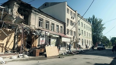 Russia-Ukraine War: A local resident clear the rubbles of his destroyed following Russian missiles strike in Kherson. (AFP) Russia-Ukraine War: A local resident clear the rubbles of his destroyed following Russian missiles strike in Kherson. (AFP)