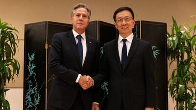Secretary of State Antony Blinken and Chinese Vice President Han Zheng shake hands while posing for photos in New York. (REUTERS)