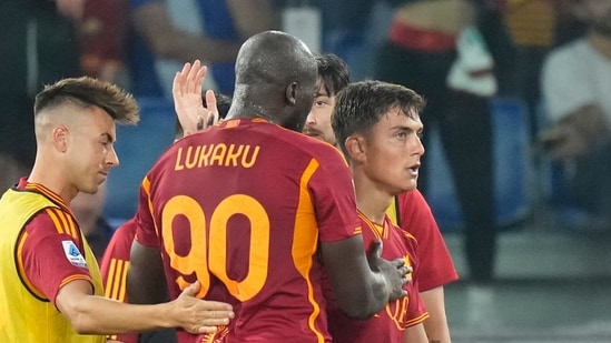 Roma's Paulo Dybala celebrates with Roma's Romelu Lukaku after scoring his side's fourth goal (AP)