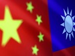 China-Taiwan Conflict: Chinese and Taiwanese flags are seen in this illustration.