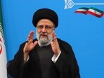Iran's President Ebrahim Raisi greets media representatives after a press conference in Tehran. Iran's President Ebrahim Raisi greets media representatives after a press conference in Tehran.
