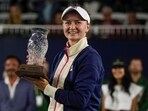 Barbora Krejcikova, of the Czech Republic, holds the trophy after defeating Sofia Kenin, of the United States, in the final match to win the San Diego Open tennis tournament