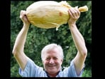 Gareth Griffin holding the huge onion he grew. Gareth Griffin holding the huge onion he grew.