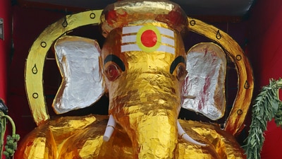 Devotees offer prayers in front of the 37-feet tall idol of Lord Ganesha made up of golden foil on the eve of the celebrations of the Ganesh Chaturthi festival, in Chennai. (ANI) Devotees offer prayers in front of the 37-feet tall idol of Lord Ganesha made up of golden foil on the eve of the celebrations of the Ganesh Chaturthi festival, in Chennai. (ANI)
