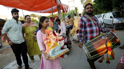 Devotees take home an idol of Lord Ganesha on the eve of the celebrations of the Ganesh Chaturthi festival in Amritsar. (ANI) Devotees take home an idol of Lord Ganesha on the eve of the celebrations of the Ganesh Chaturthi festival in Amritsar. (ANI)