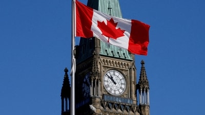 Canadian flag flies in front of the Peace Tower on Parliament Hill in Ottawa, Ontario, Canada. (Reuters)