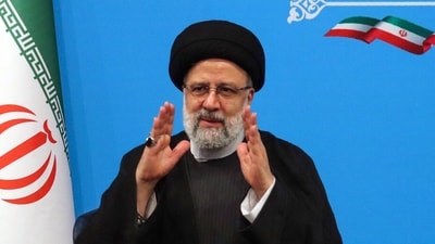Iran's President Ebrahim Raisi greets media representatives after a press conference in Tehran. (AFP) Iran's President Ebrahim Raisi greets media representatives after a press conference in Tehran. (AFP)