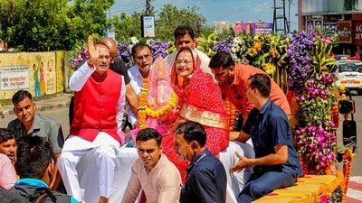 Madhya Pradesh Chief Minister Shivraj Singh Chouhan with his wife Sadhna Singh and son Kartikeya Singh Chouhan carry an idol of Lord Ganesha for installation at their residence on the occasion of Ganesh Chaturthi. (PTI) Madhya Pradesh Chief Minister Shivraj Singh Chouhan with his wife Sadhna Singh and son Kartikeya Singh Chouhan carry an idol of Lord Ganesha for installation at their residence on the occasion of Ganesh Chaturthi. (PTI)