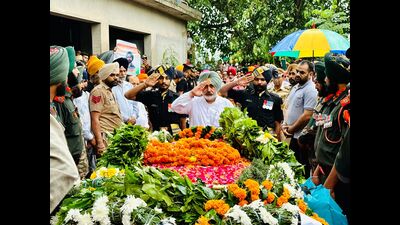 Punjab minister Chetan Singh Jouramajra pays last respect to the mortal remains of sepoy Pardeep Singh in Patiala on Tuesday. (HT photo) Punjab minister Chetan Singh Jouramajra pays last respect to the mortal remains of sepoy Pardeep Singh in Patiala on Tuesday. (HT photo)
