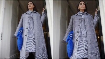 Sonam accessorised her check-printed look with calf-length boots, statement silver earrings, ear cuffs, and a deep blue Burberry fur bag. The quirky handbag stole the show! Lastly, Sonam chose centre-parted open locks, feathered brows, mascara on the lashes, subtle pink eye shadow, blushed cheeks, berry-toned lip shade, a dewy base, and on-fleek contouring for the glam picks. Sonam accessorised her check-printed look with calf-length boots, statement silver earrings, ear cuffs, and a deep blue Burberry fur bag. The quirky handbag stole the show! Lastly, Sonam chose centre-parted open locks, feathered brows, mascara on the lashes, subtle pink eye shadow, blushed cheeks, berry-toned lip shade, a dewy base, and on-fleek contouring for the glam picks. 