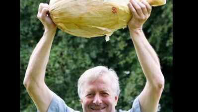 Gareth Griffin holding the huge onion he grew. (Instagram/@Harrogate Autumn Flower Show) Gareth Griffin holding the huge onion he grew. (Instagram/@Harrogate Autumn Flower Show)