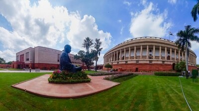 The existing Parliament building and the new complex (L) on the first day of the special session of Parliament, in New Delhi, Monday. (PTI) The existing Parliament building and the new complex (L) on the first day of the special session of Parliament, in New Delhi, Monday. (PTI)
