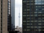 Tokyo Skytree, the world's tallest broadcasting tower, is seen between office buildings in Tokyo, Japan. Japan tourism recovers to more than 80% of pre-pandemic levels for first time 