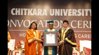 Chitkara University chancellor Dr Ashok Chitkara and pro-chancellor Dr Madhu Chitkara awarding a degree to J A Chowdary at Chitkara University Punjab campus. (HT Photo) Chitkara University chancellor Dr Ashok Chitkara and pro-chancellor Dr Madhu Chitkara awarding a degree to J A Chowdary at Chitkara University Punjab campus. (HT Photo)