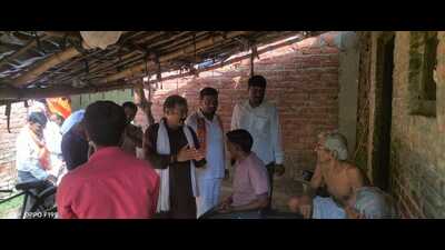 Kashi region BJP president Dilip Singh Patel during the door-to-door campaign at Veerbhanpur (HT Photo)