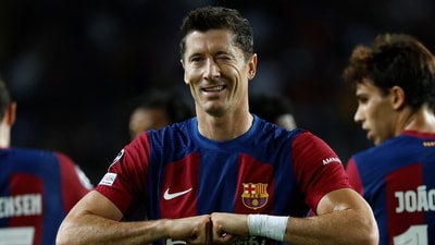 Barcelona's Robert Lewandowski celebrates after scoring his side's second goal during the Champions League Group H game (AP) Barcelona's Robert Lewandowski celebrates after scoring his side's second goal during the Champions League Group H game (AP)