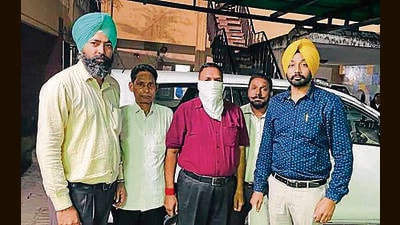 The accused ASI in the vigilance bureau custody in Ludhiana. (ht photo)