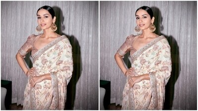 Manushi looked ethereal in the sheer white saree featuring floral details in embroidery work throughout the saree, and zari work at the borders. She teamed it with a golden blouse with long sleeves. (Instagram/@manushi_chhillar) Manushi looked ethereal in the sheer white saree featuring floral details in embroidery work throughout the saree, and zari work at the borders. She teamed it with a golden blouse with long sleeves. (Instagram/@manushi_chhillar)
