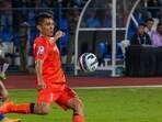 India's captain Sunil Chhetri (orange) in action against Kuwait 