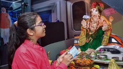 <p>A girl offers prayers to Lord Ganesh in a model of Vande Bharat express on the occasion of Ganesh Chathurthi, in Mumbai on Wednesday</p> (ANI) <p>A girl offers prayers to Lord Ganesh in a model of Vande Bharat express on the occasion of Ganesh Chathurthi, in Mumbai on Wednesday</p> (ANI)
