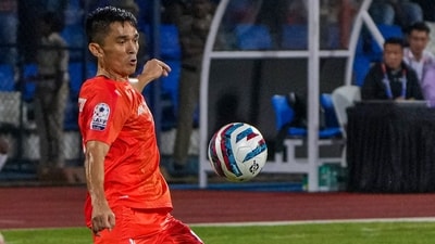 India's captain Sunil Chhetri (orange) in action against Kuwait (PTI) India's captain Sunil Chhetri (orange) in action against Kuwait (PTI)