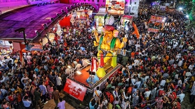 Devotees take part in a Ganesh Chaturthi procession at Moti Doongri Ganesh Temple in Jaipur. (PTI) Devotees take part in a Ganesh Chaturthi procession at Moti Doongri Ganesh Temple in Jaipur. (PTI)