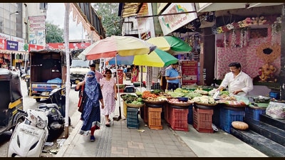 Vegetable seller seen occupying a footpath at Mandai Road. (Rahul Raut/HT PHOTO) Vegetable seller seen occupying a footpath at Mandai Road. (Rahul Raut/HT PHOTO)