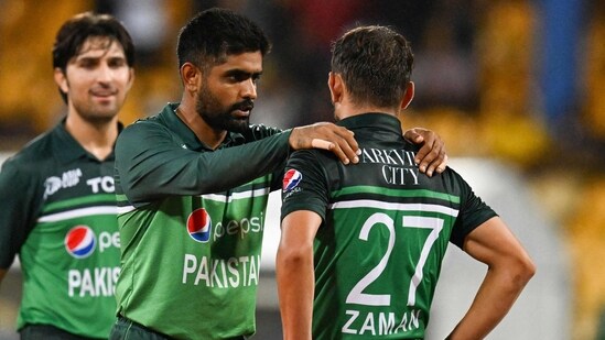 Pakistan's captain Babar Azam (C) speaks with Zaman Khan (R) on the last over during the Asia Cup 2023 Super Four one-day international (ODI) cricket match (AFP)