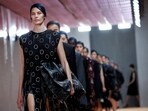 A model presents a creation from the Prada Spring/Summer 2024 collection during Fashion Week in Milan, Italy. 