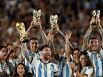 Argentina's Lionel Messi and team mates celebrate with their families after FIFA World Cup win