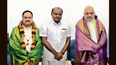 BJP president JP Nadda, JD(S) leader HD Kumaraswamy and home minister Amit Shah on Friday. (PTI) BJP president JP Nadda, JD(S) leader HD Kumaraswamy and home minister Amit Shah on Friday. (PTI)