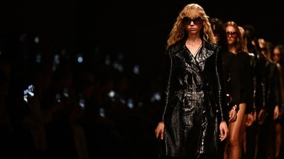Models walk the runway at the Tom Ford fashion show during the Milan Fashion Week showcasing womenswear Spring/Summer 2024 collection. (Photo by GABRIEL BOUYS / AFP) Models walk the runway at the Tom Ford fashion show during the Milan Fashion Week showcasing womenswear Spring/Summer 2024 collection. (Photo by GABRIEL BOUYS / AFP)