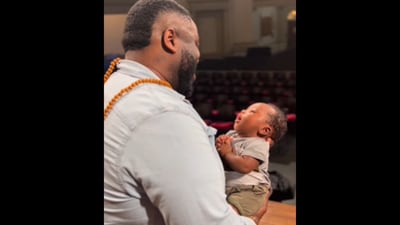 The image shows a dad holding his three-month-old son. (Instagram/@tamar.greene) The image shows a dad holding his three-month-old son. (Instagram/@tamar.greene)