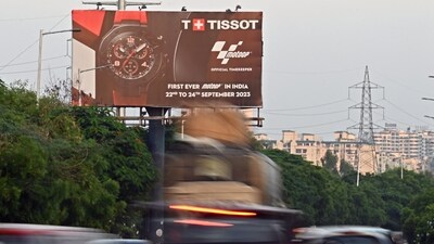 Motorists ride past a billboard of India's maiden MotoGP displayed along a busy road on Noida. (AFP) Motorists ride past a billboard of India's maiden MotoGP displayed along a busy road on Noida. (AFP)