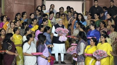 Prime Minister Narendra Modi flashes victory sign with women MPs as they celebrate after the passage of the Nari Shakti Vandan Adhiniyam (women's reservation bill) by the Rajya Sabha in the special session of the Parliament, in New Delhi, Thursday. (PTI) Prime Minister Narendra Modi flashes victory sign with women MPs as they celebrate after the passage of the Nari Shakti Vandan Adhiniyam (women's reservation bill) by the Rajya Sabha in the special session of the Parliament, in New Delhi, Thursday. (PTI)