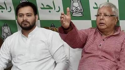 RJD supremo Lalu Prasad Yadav (right) and Bihar deputy CM Tejashwi Yadav (left) (File Photo)