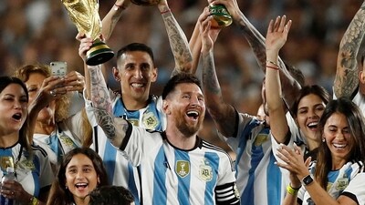 Argentina's Lionel Messi and team mates celebrate with their families after FIFA World Cup win (REUTERS)
