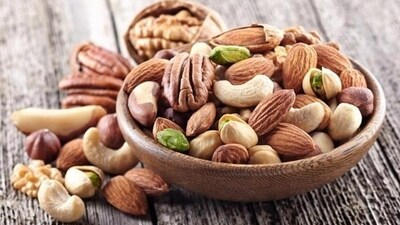 Nuts have abundant monounsaturated fats, with almonds and others rich in L-arginine—a key amino acid that aids in nitric oxide production, assisting blood pressure regulation. Furthermore, nuts contain phytosterols, akin to cholesterol, which hinder its absorption in your intestines, actively lowering cholesterol levels. (Shutterstock) Nuts have abundant monounsaturated fats, with almonds and others rich in L-arginine—a key amino acid that aids in nitric oxide production, assisting blood pressure regulation. Furthermore, nuts contain phytosterols, akin to cholesterol, which hinder its absorption in your intestines, actively lowering cholesterol levels. (Shutterstock)