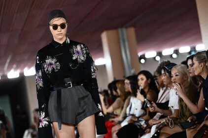 A model walks the runway of the Prada fashion show during the Milan Fashion Week Womenswear Spring/Summer 2024. (Photo by Marco BERTORELLO / AFP) A model walks the runway of the Prada fashion show during the Milan Fashion Week Womenswear Spring/Summer 2024. (Photo by Marco BERTORELLO / AFP)