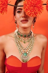 Beautiful pieces in emerald, by Pareena Jewels, are displayed as part of this showcase.