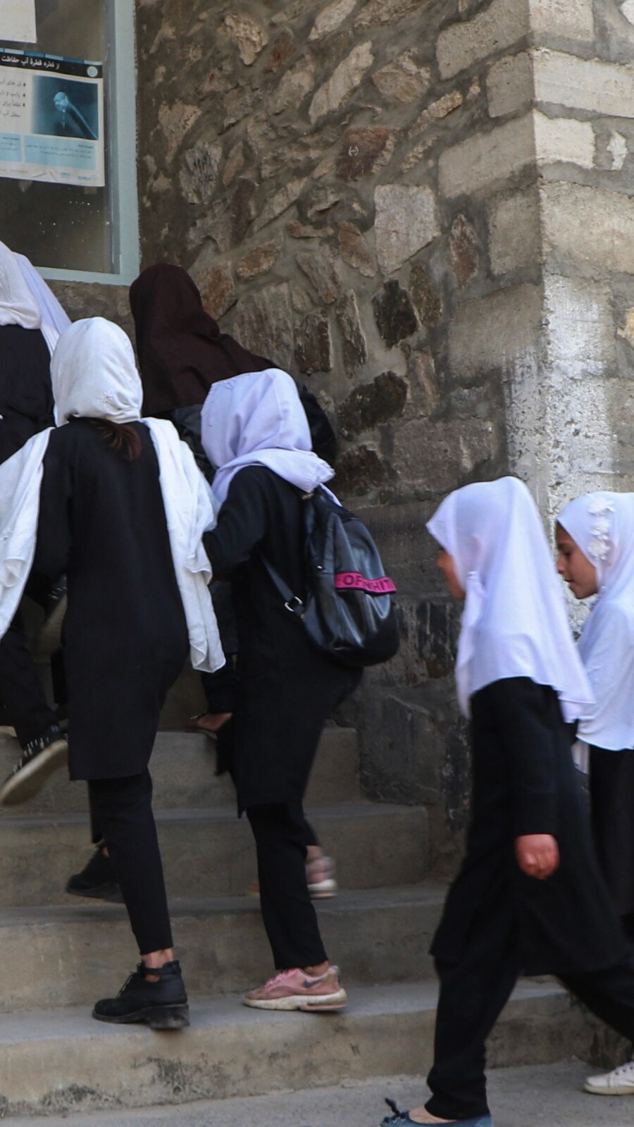 Children, in queue, seen walking to school. (AFP )