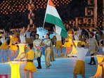 Flag-bearers Lovlina Borgohain and Harmanpreet Singh lead the Indian contingent during the opening ceremony of the 19th Asian Games at the Hangzhou Olympic Sports Centre Stadium, in Hangzhou, China(PTI)