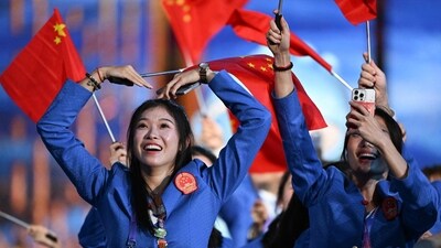 A member of China's delegation gestures during the opening ceremony of the 2022 Asian Games at the Hangzhou Olympic Sports Centre Stadium in Hangzhou (AFP)